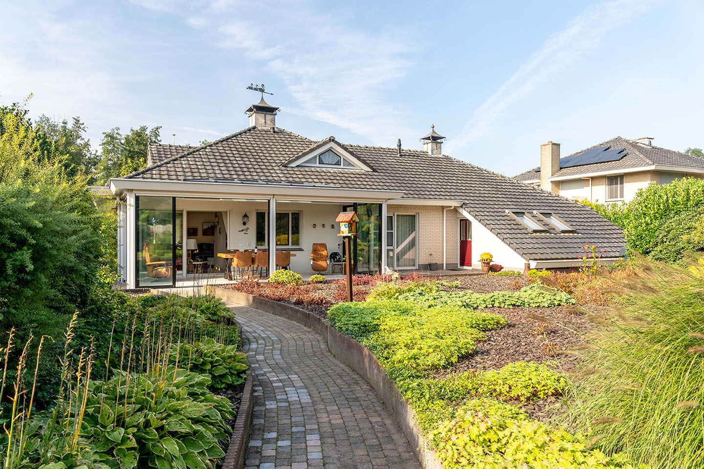 Tuinkamer in de stijl van de woning